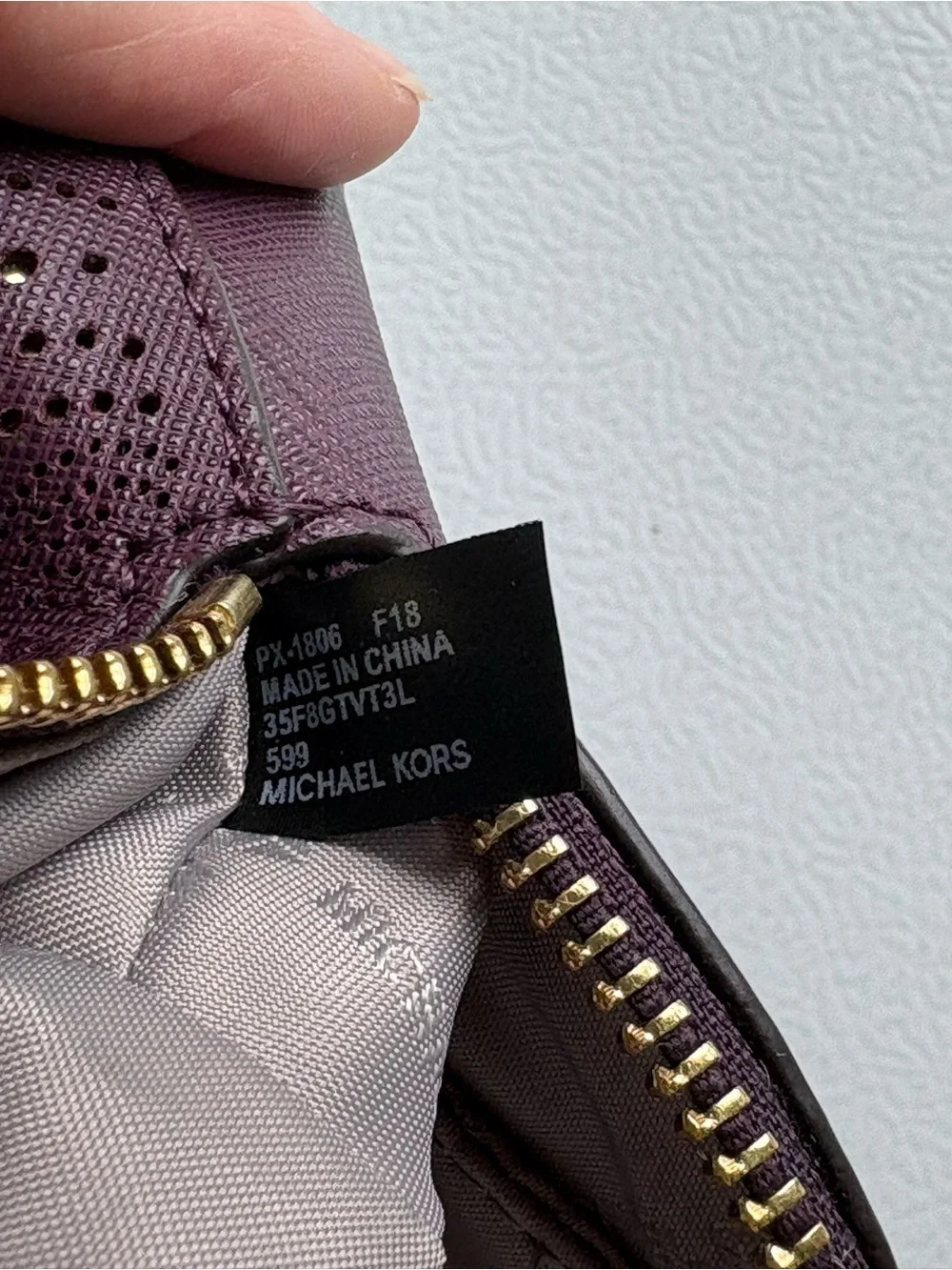 Michael Kors Plum Perforated Leather Cosmetic Pouch